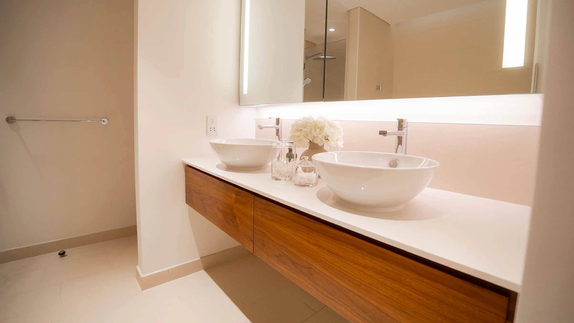 Architectural luxury villa interior in Dubai with warm limestone, bespoke furnishing and soft natural light